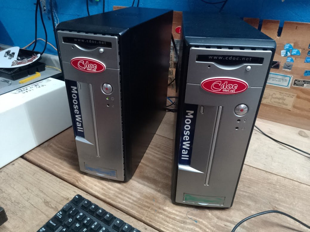 Two MooseWall firewall units on the bench — Cdoc Security Lab
